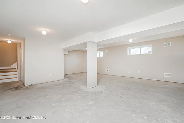 an empty room with entrance and empty room