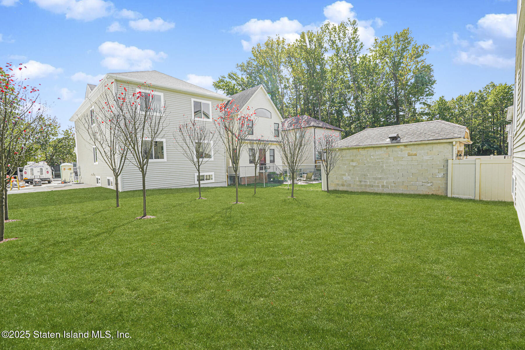 291 Rensselaer Avenue Staten Island, NY 10312 - Photo 38 of 38 a view of a house with a yard and a tree