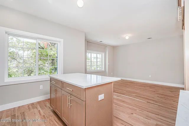 a kitchen that has a sink and a window in it