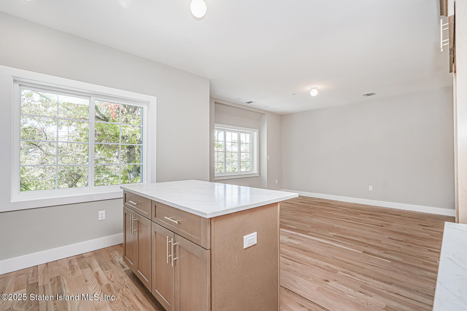 291 Rensselaer Avenue Staten Island, NY 10312 - Photo 8 of 38 a kitchen that has a sink and a window in it