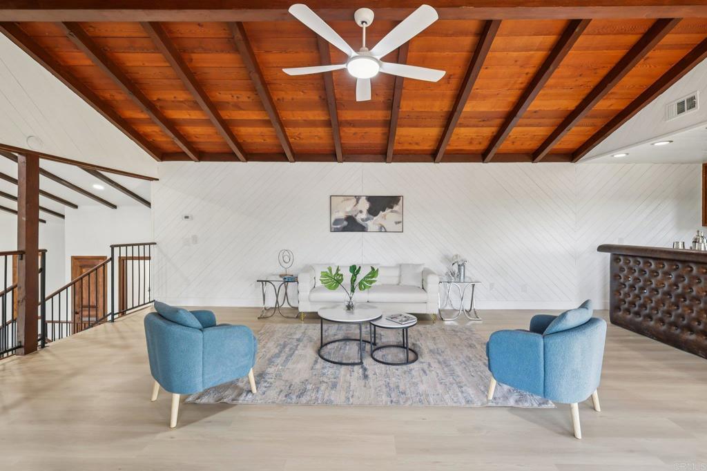 2865 Via Dieguenos Alpine, CA 91901 - Photo 23 of 75 a living room with furniture and a wooden floor