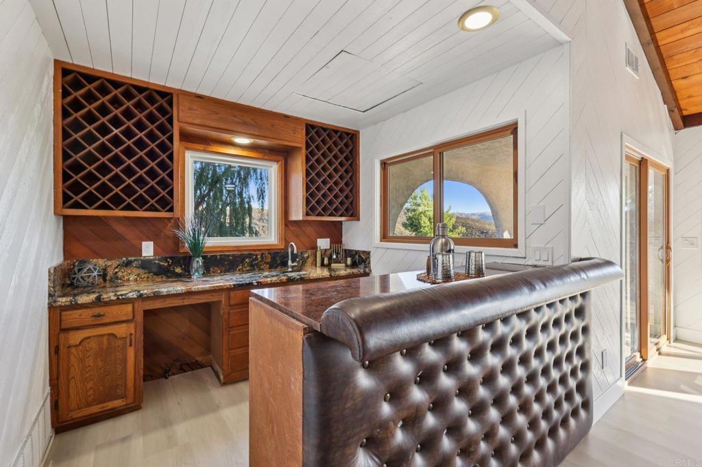 2865 Via Dieguenos Alpine, CA 91901 - Photo 26 of 75 a living room with furniture a large window and a flat screen tv