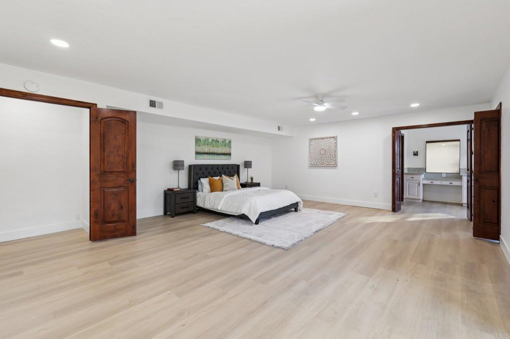 2865 Via Dieguenos Alpine, CA 91901 - Photo 29 of 75 a bedroom with a bed and a walk in closet