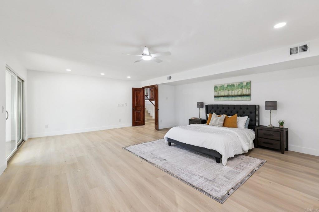 2865 Via Dieguenos Alpine, CA 91901 - Photo 30 of 75 a spacious bedroom with a bed and a lamp