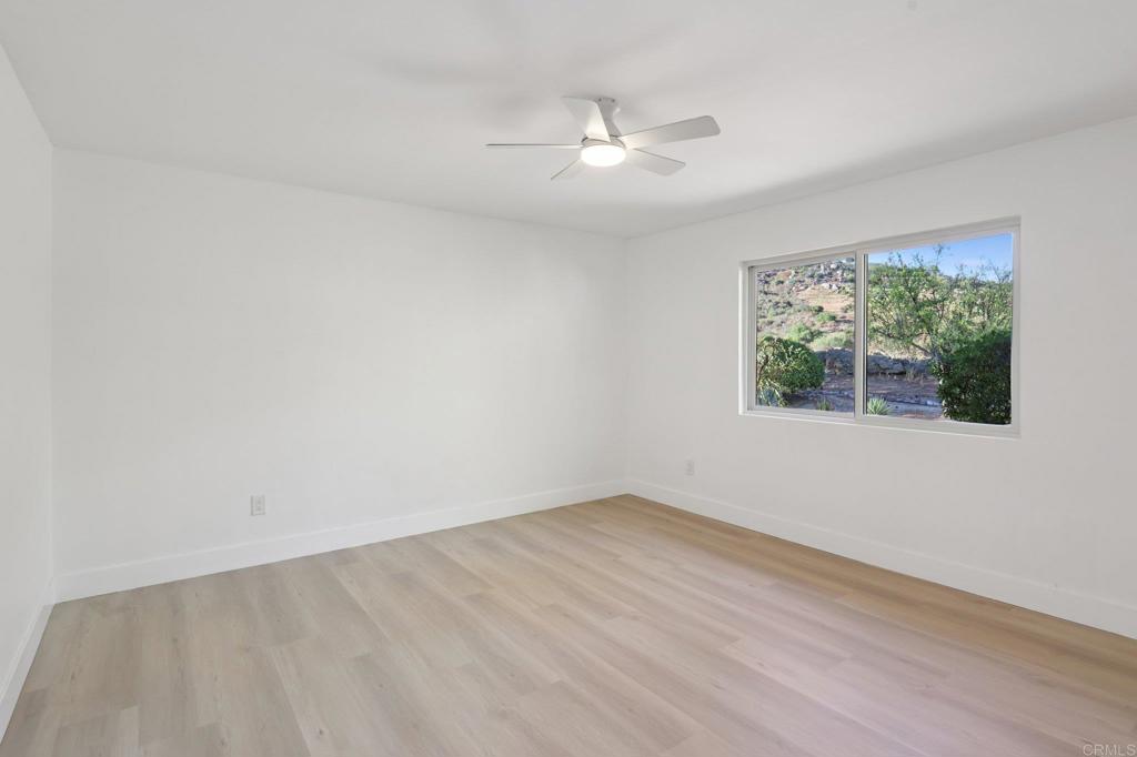 2865 Via Dieguenos Alpine, CA 91901 - Photo 41 of 75 a view of an empty room with wooden floor and a window