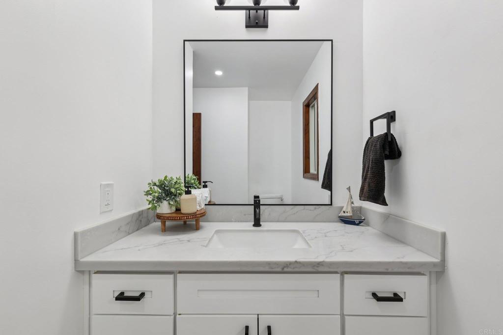 2865 Via Dieguenos Alpine, CA 91901 - Photo 42 of 75 a bathroom with a sink and a mirror