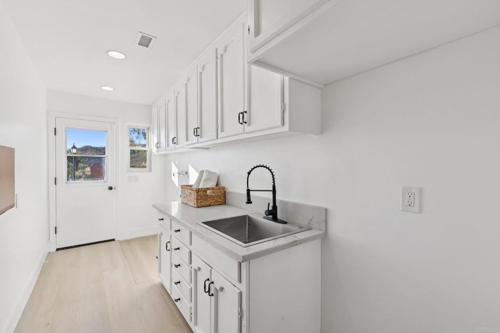 2865 Via Dieguenos Alpine, CA 91901 - Photo 54 of 75 a kitchen with stainless steel appliances granite countertop a sink and a refrigerator
