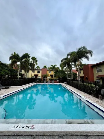 a view of a swimming pool with a patio