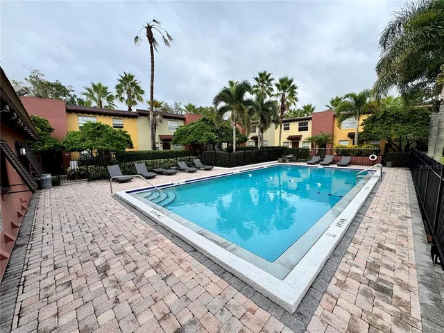 a view of a swimming pool with a patio