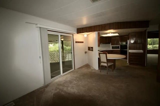 a view of an empty room with closet