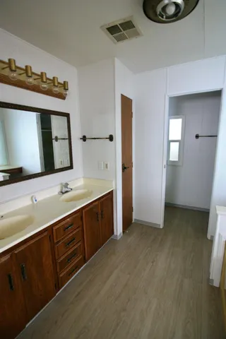 a bathroom with a tub and a shower