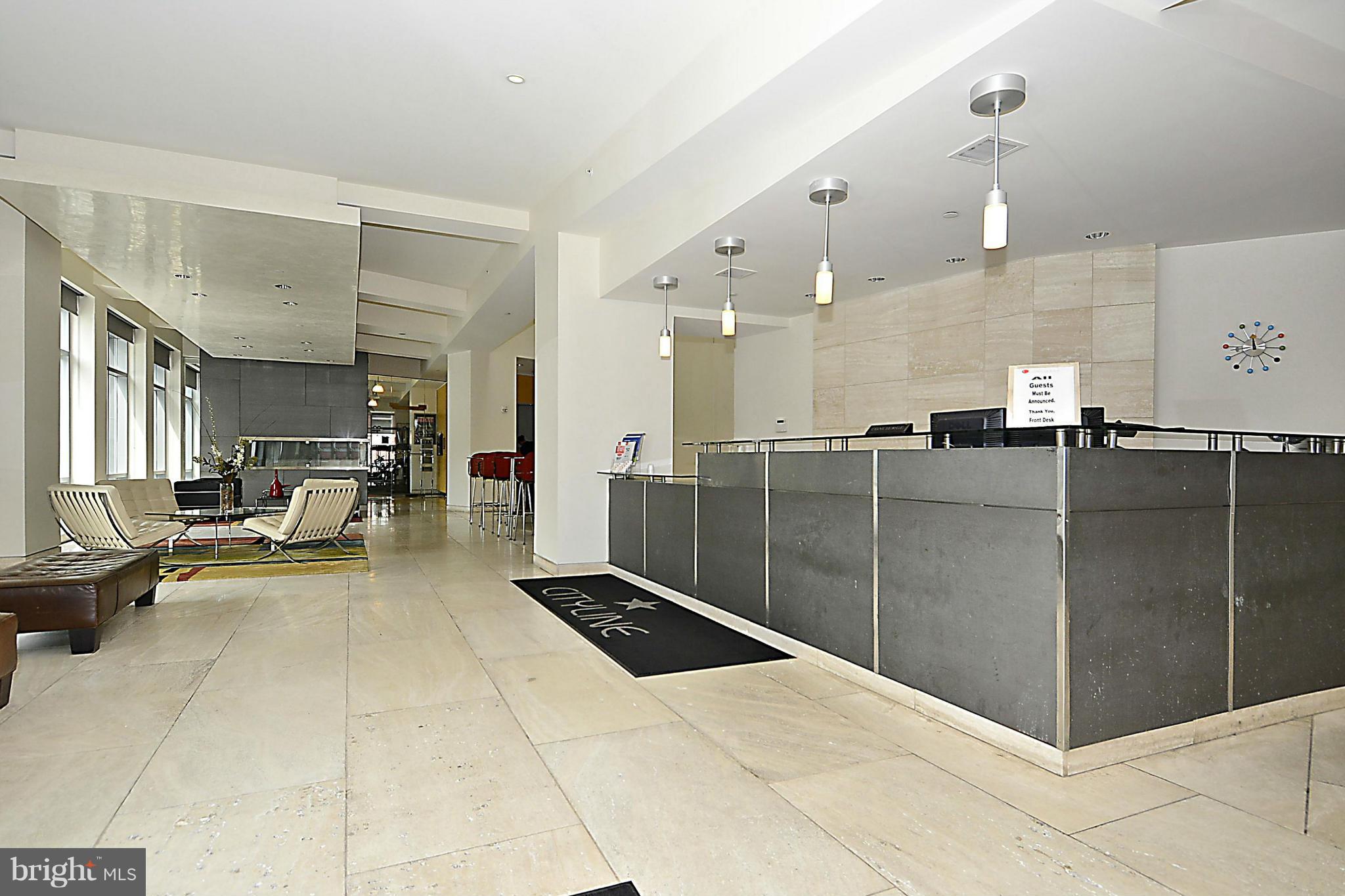 4101 Albemarle Street Northwest, Unit 337 Washington, DC 20016 - Photo 29 of 30 a lobby with a black and white walls