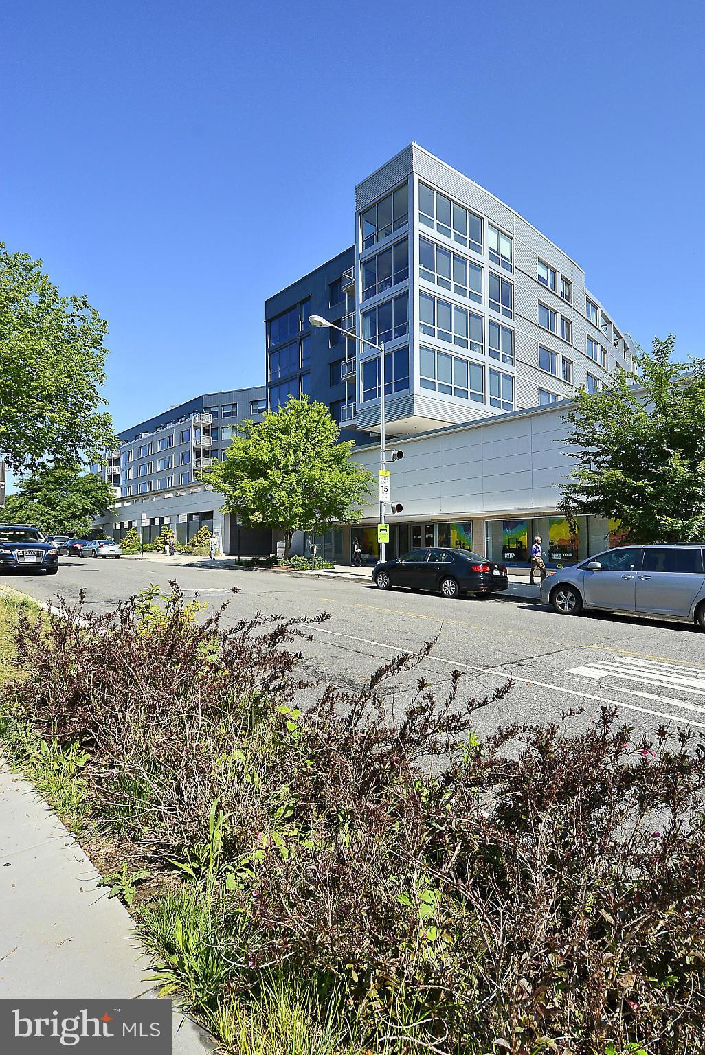 4101 Albemarle Street Northwest, Unit 337 Washington, DC 20016 - Photo 30 of 30 a front view of a building with a yard