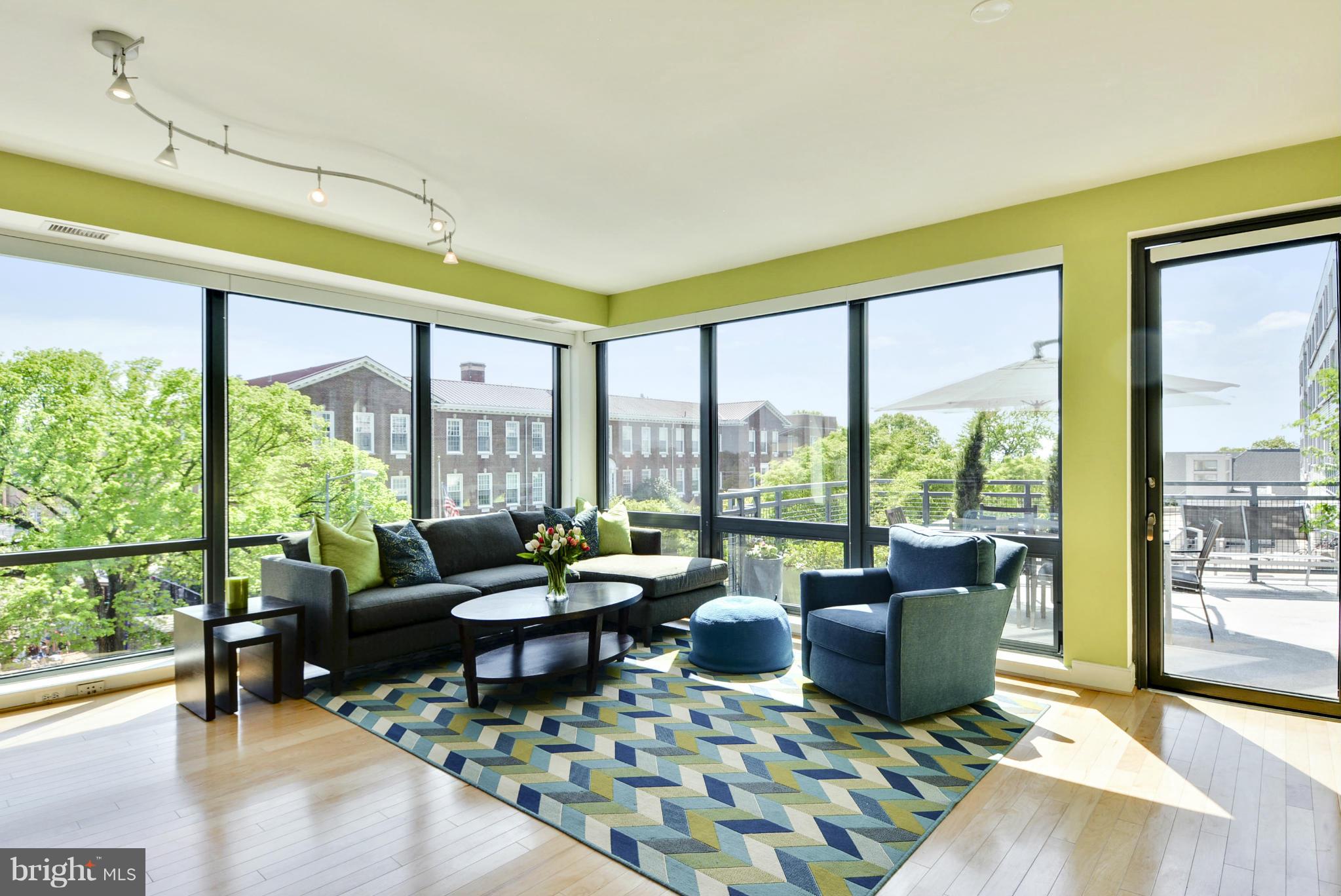 4101 Albemarle Street Northwest, Unit 337 Washington, DC 20016 - Photo 3 of 30 a living room with furniture and a large window