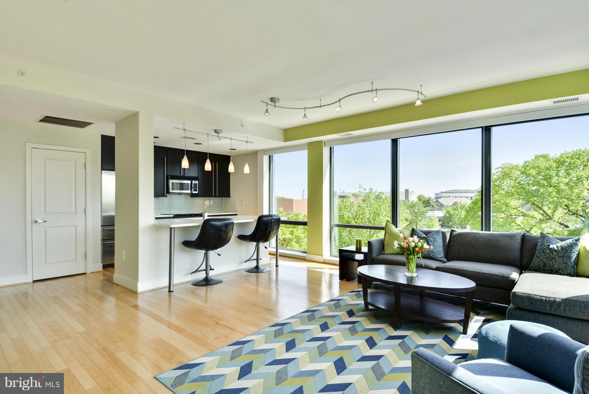 4101 Albemarle Street Northwest, Unit 337 Washington, DC 20016 - Photo 5 of 30 a living room with furniture and a large window