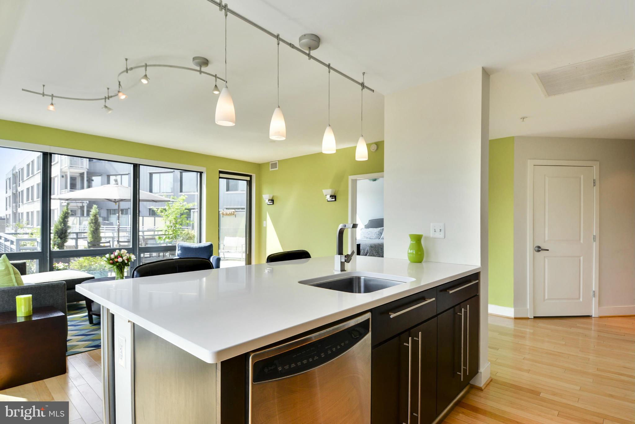 4101 Albemarle Street Northwest, Unit 337 Washington, DC 20016 - Photo 6 of 30 a kitchen with a sink appliances and a large window