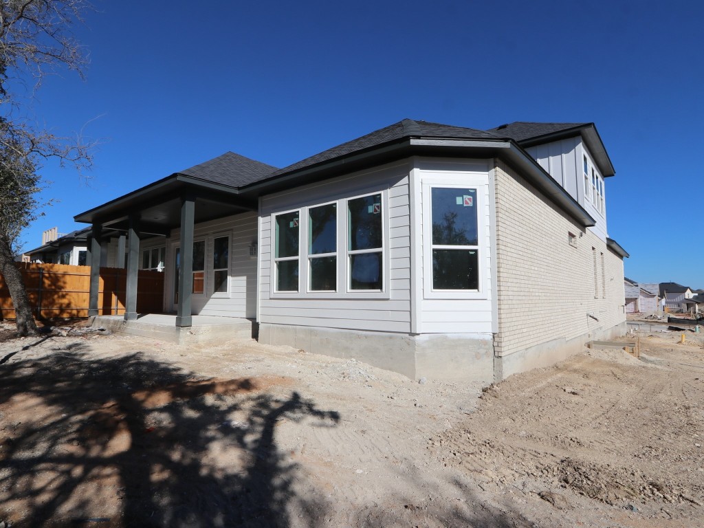 350 Bishop Wood Road Dripping Springs, TX 78620 - Photo 12 of 17 a front view of a house with a yard
