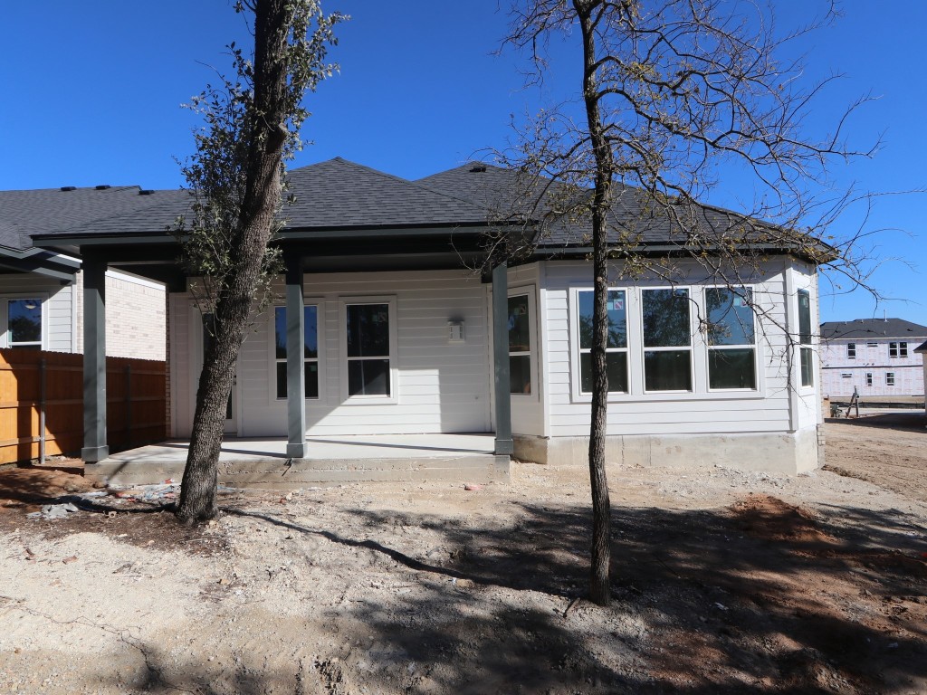 350 Bishop Wood Road Dripping Springs, TX 78620 - Photo 14 of 17 a front view of a house with a porch