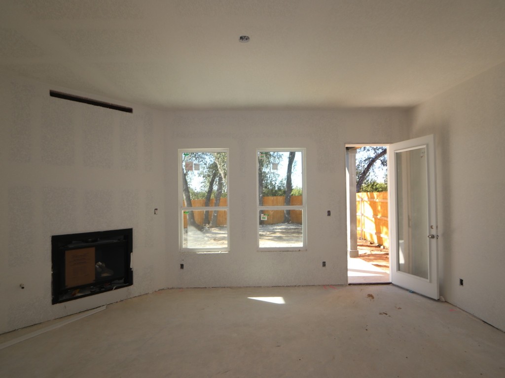 350 Bishop Wood Road Dripping Springs, TX 78620 - Photo 3 of 17 an empty room with windows