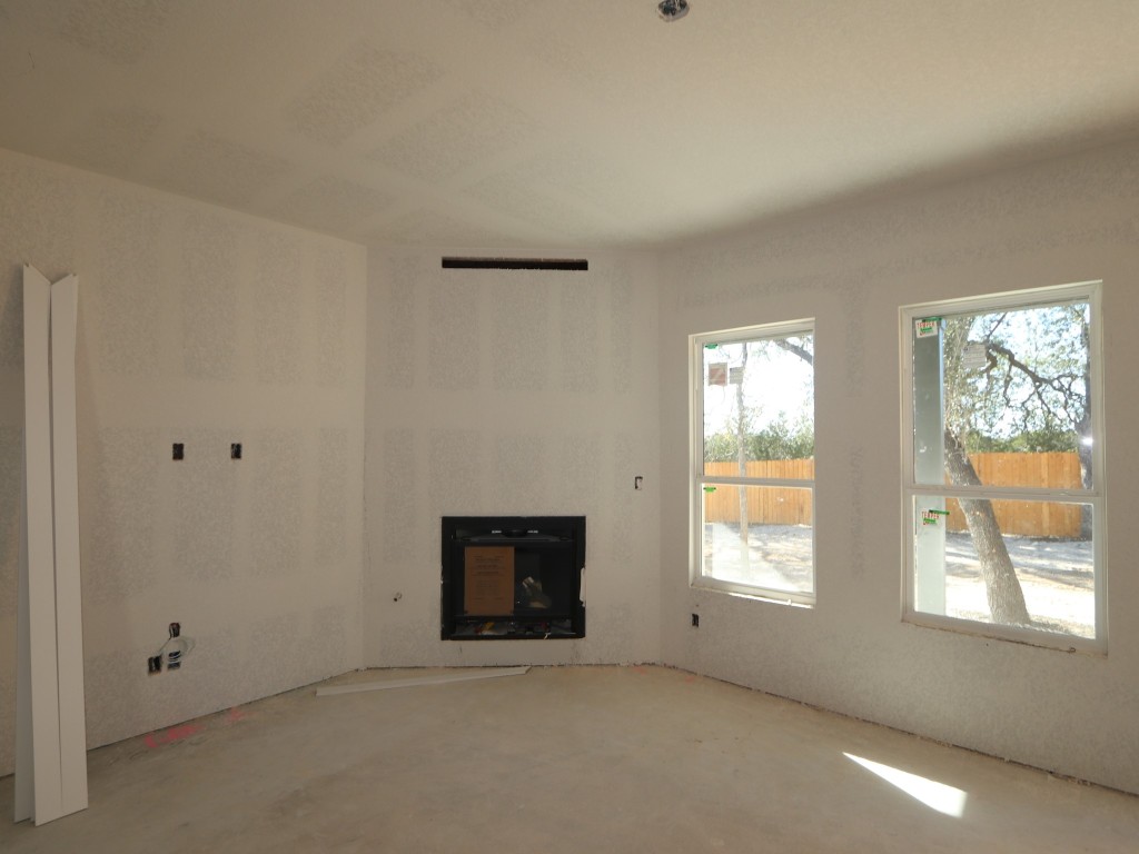 350 Bishop Wood Road Dripping Springs, TX 78620 - Photo 4 of 17 an empty room with windows