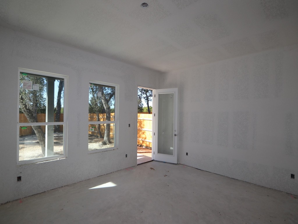 350 Bishop Wood Road Dripping Springs, TX 78620 - Photo 5 of 17 an empty room with windows