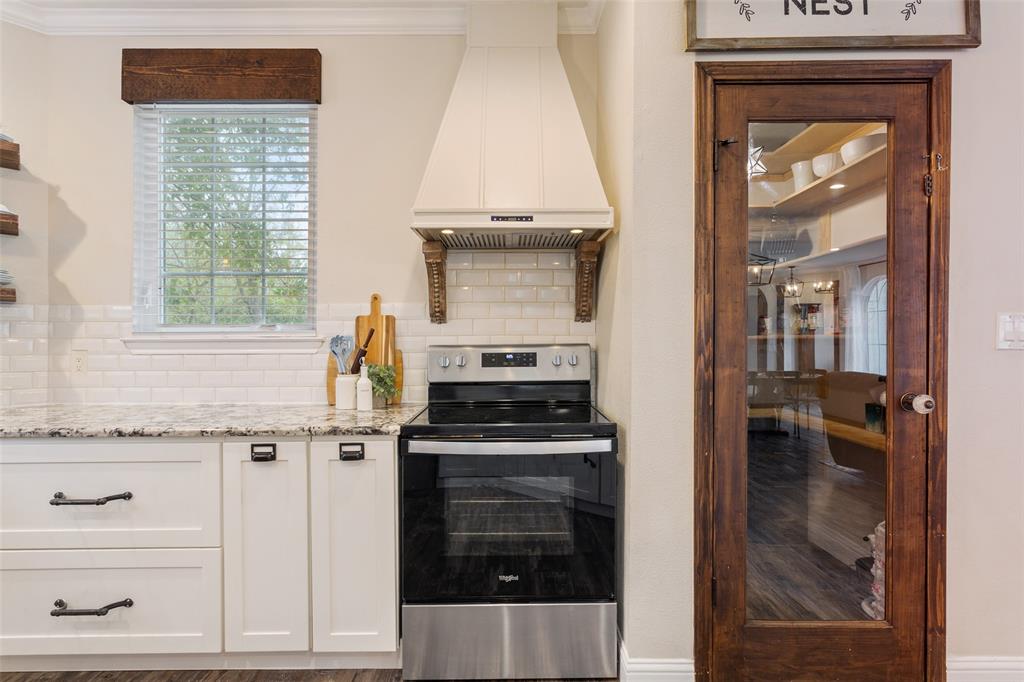 566 Benevolence Way China Spring, TX 76633 - Photo 17 of 35 a kitchen with a stove and a microwave