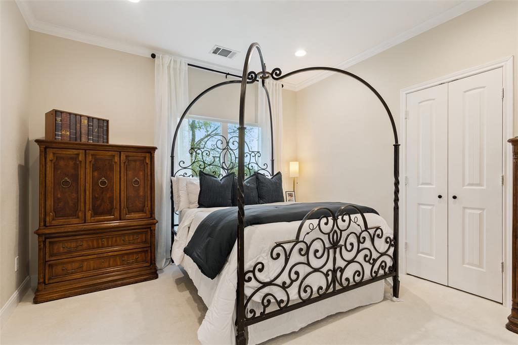 566 Benevolence Way China Spring, TX 76633 - Photo 20 of 35 a bedroom with a bed and a mirror