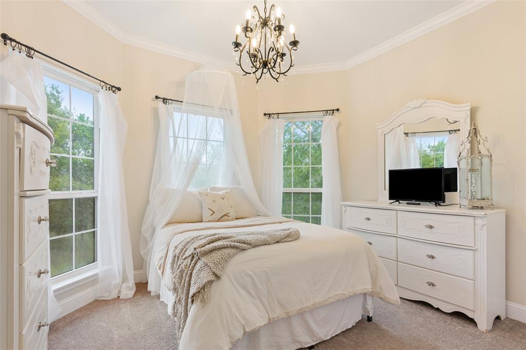 566 Benevolence Way China Spring, TX 76633 - Photo 23 of 35 a bedroom with a bed and a flat screen tv