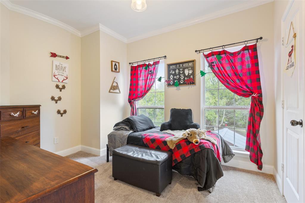 566 Benevolence Way China Spring, TX 76633 - Photo 25 of 35 a bedroom with a bed and a window