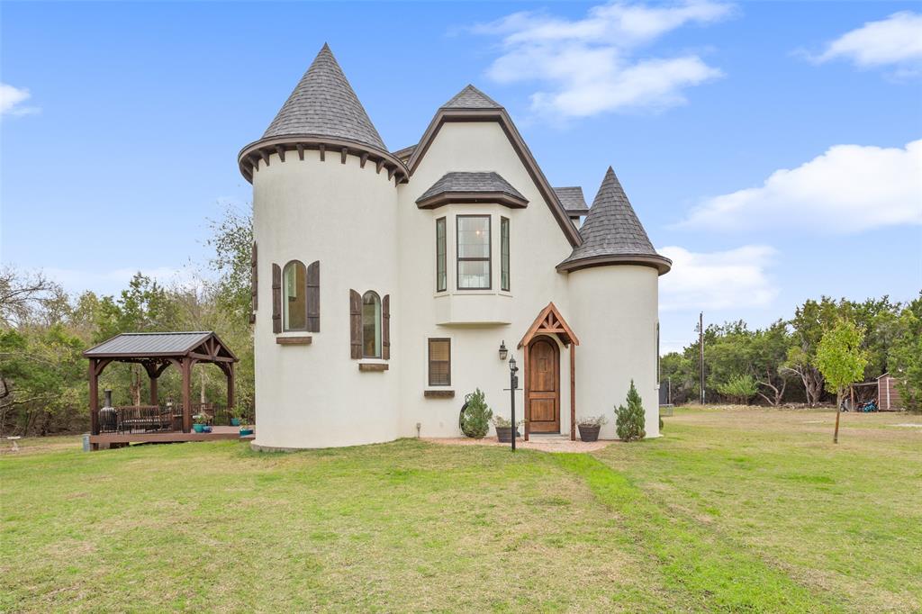 566 Benevolence Way China Spring, TX 76633 - Photo 3 of 35 a front view of a house with a garden