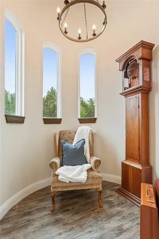 a living room with furniture wooden floor and a table