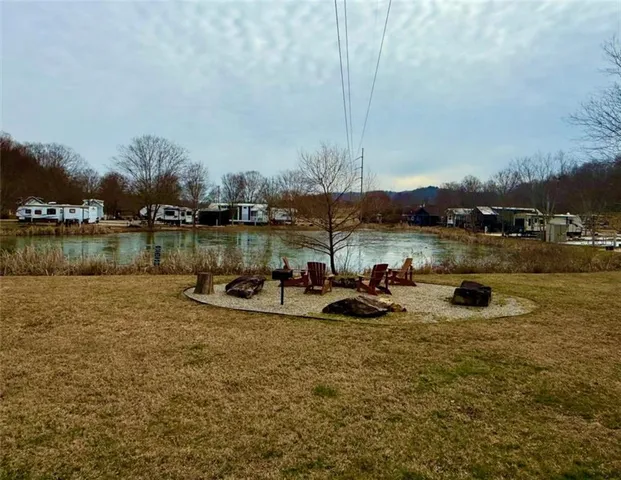 a view of a lake with houses in the back