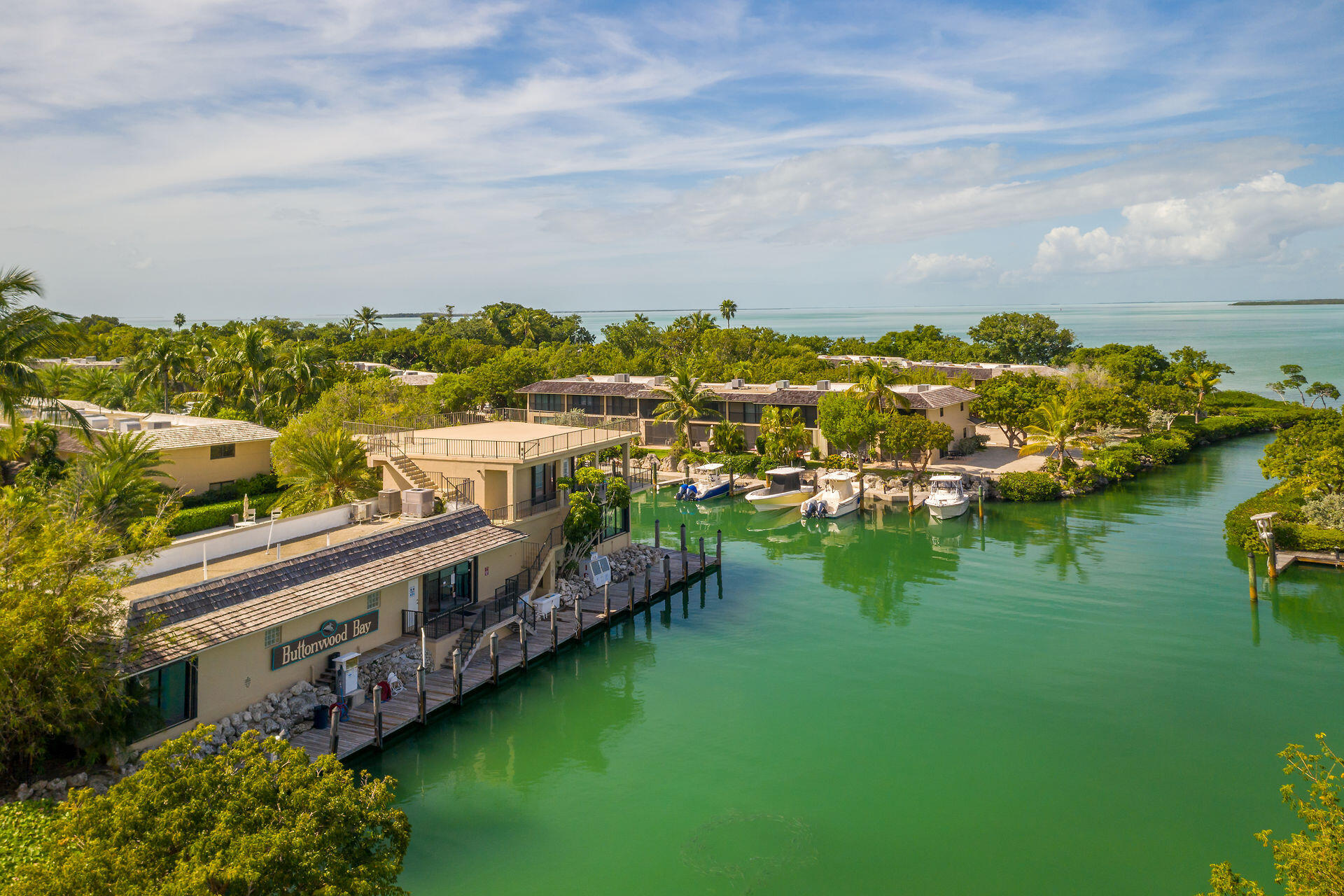 96000 Overseas Highway, Unit E5 Key Largo, FL 33037 - Photo 46 of 47 a view of a lake with houses