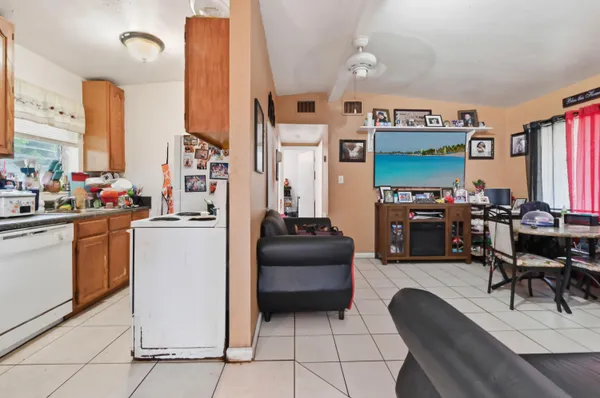 a kitchen with stainless steel appliances a stove top oven and cabinets