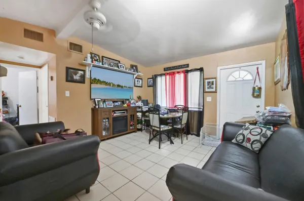 a living room with furniture and a large window