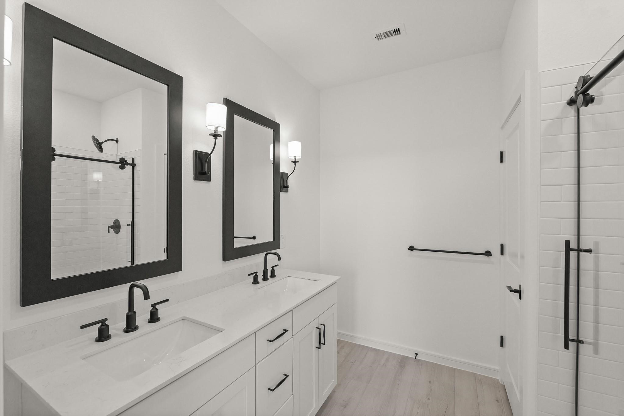 7815 Jade Crest Drive Angleton, TX 77515 - Photo 15 of 31 a bathroom with 2 sink and a mirror