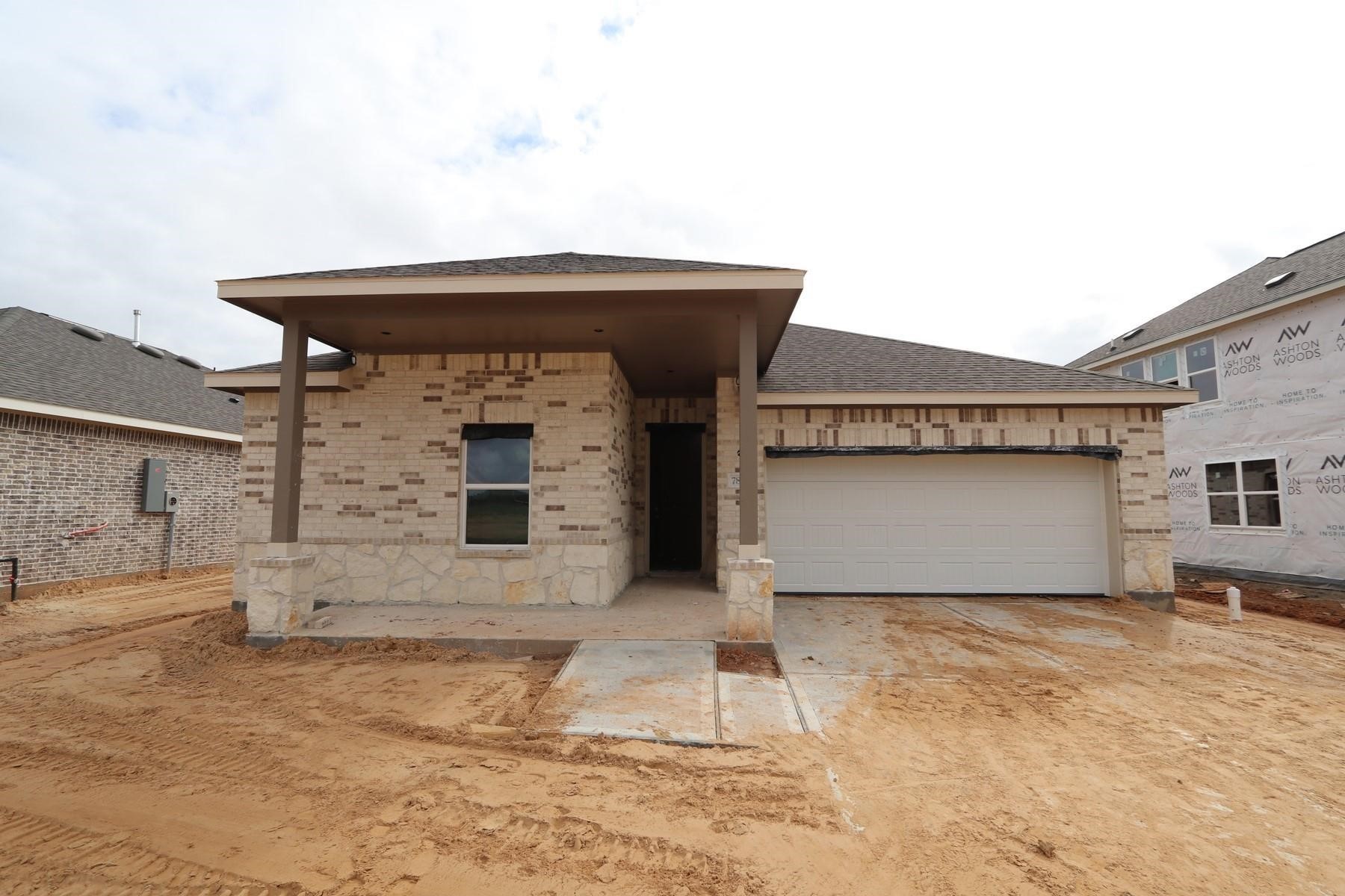 7815 Jade Crest Drive Angleton, TX 77515 - Photo 2 of 31 a front view of a house with a garage