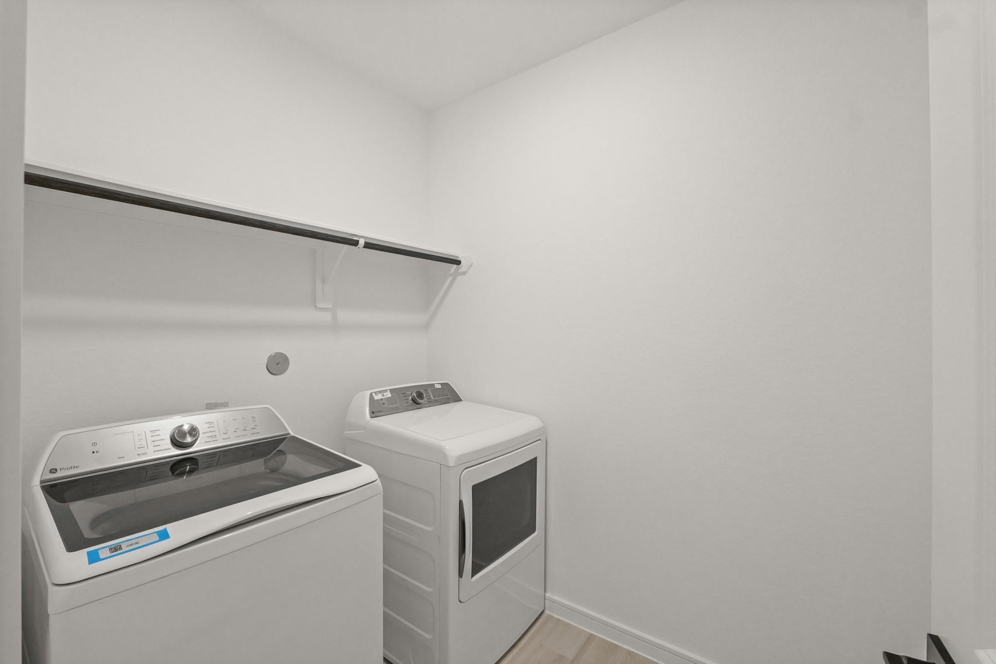 7815 Jade Crest Drive Angleton, TX 77515 - Photo 23 of 31 a utility room with dryer and washer