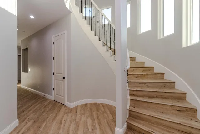 a view of staircase with wooden floor and staircase