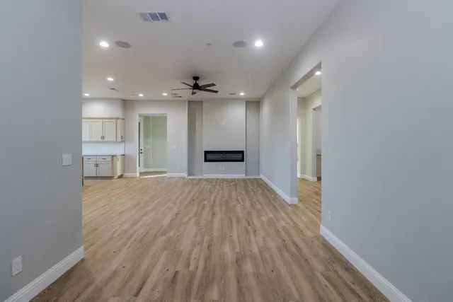 a view of a kitchen with a sink and a refrigerator