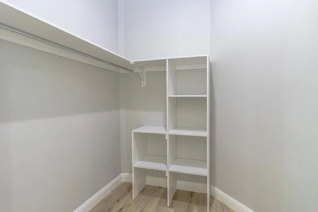 a room with a chair and a window