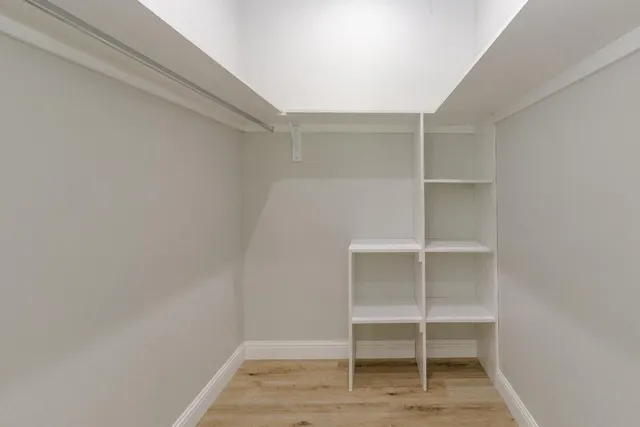 a view of an empty walk in closet