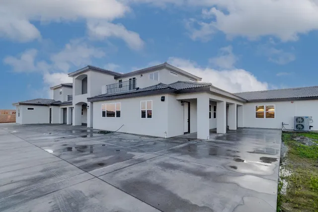 a view of a room with gym equipment and windows