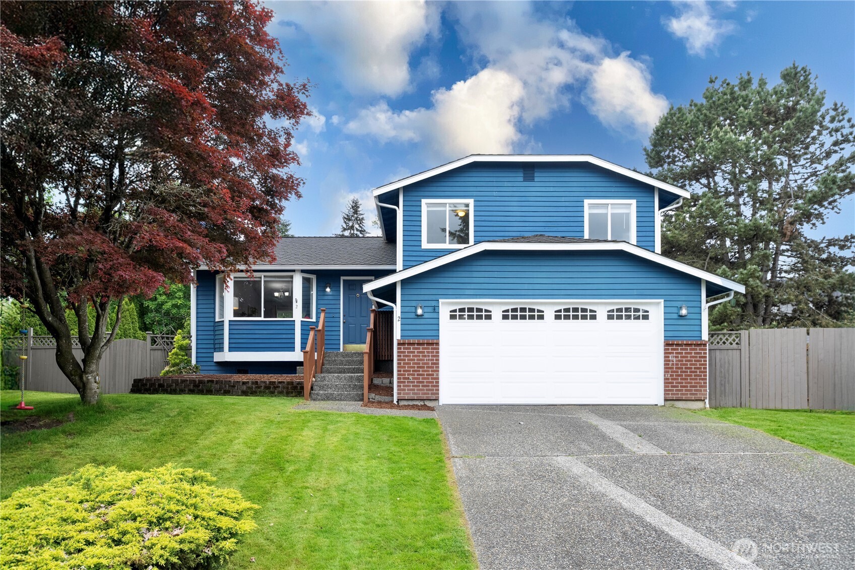 2 199th Place Southeast Bothell, WA 98012 - Photo 1 of 30 a front view of a house with a garden and yard