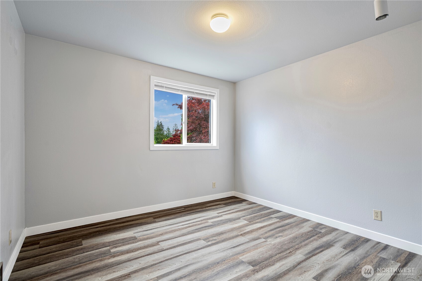 2 199th Place Southeast Bothell, WA 98012 - Photo 16 of 30 a view of empty room with wooden floor