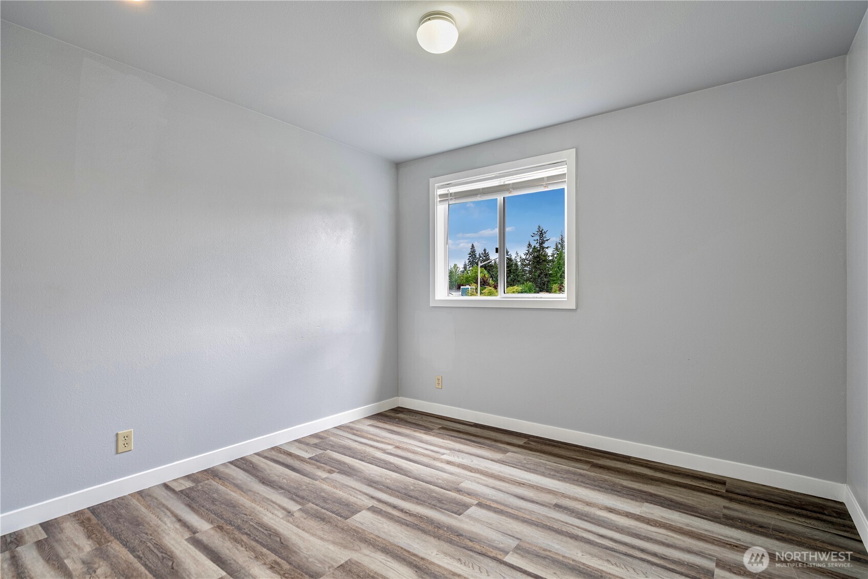 2 199th Place Southeast Bothell, WA 98012 - Photo 17 of 30 a view of empty room with wooden floor