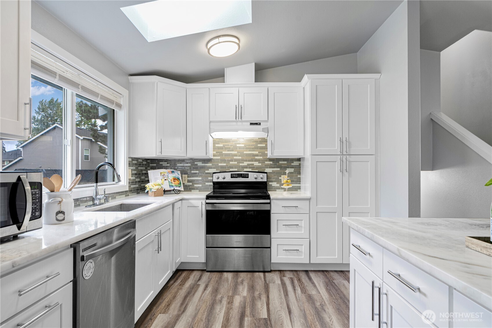 2 199th Place Southeast Bothell, WA 98012 - Photo 18 of 30 a kitchen with a stove sink and a refrigerator