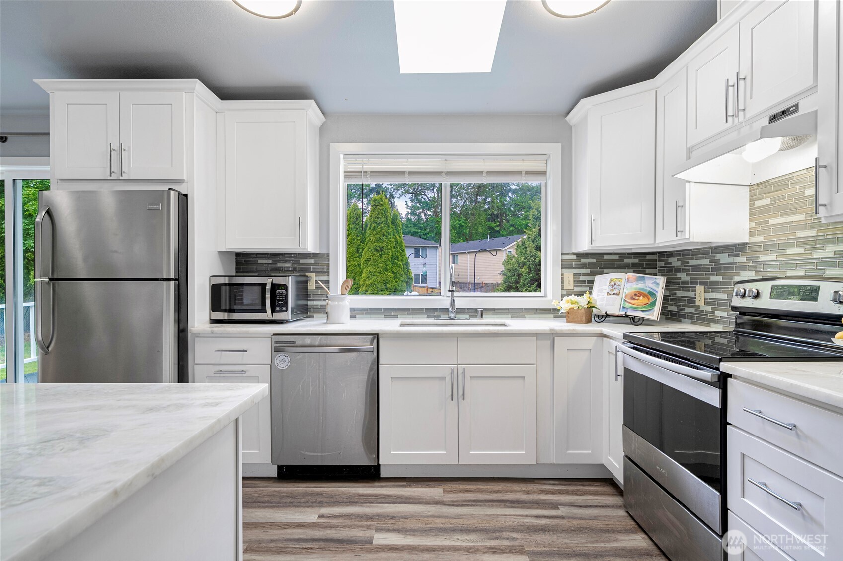 2 199th Place Southeast Bothell, WA 98012 - Photo 7 of 30 a kitchen with a refrigerator stove and sink