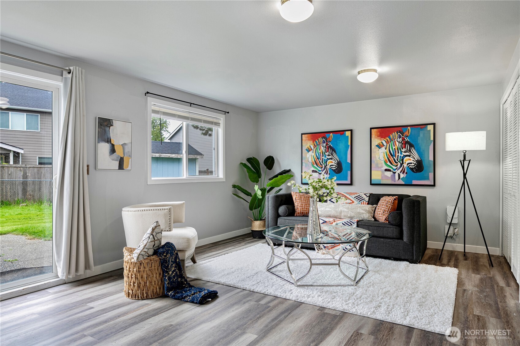 2 199th Place Southeast Bothell, WA 98012 - Photo 10 of 30 a living room with furniture a wooden floor and a potted plant
