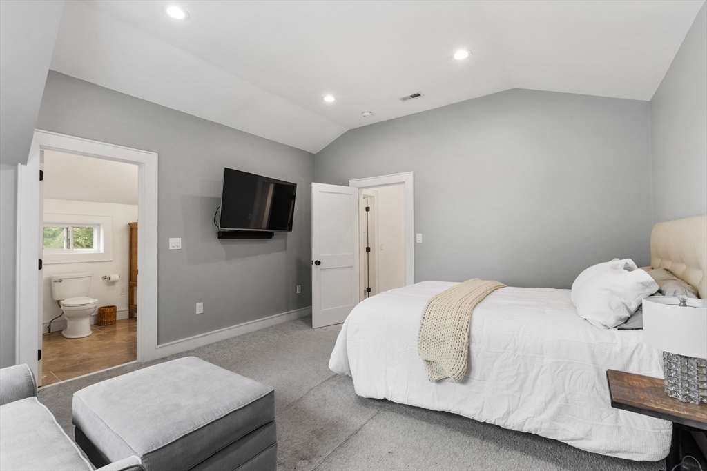 46 Crescent Avenue Lynnfield, MA 01940 - Photo 13 of 16 a bedroom with a bed and a television